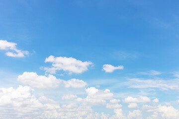 Wall Mural - blue sky background and white clouds soft focus, and copy space horizontal shape.