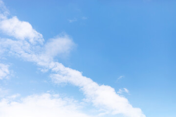 Wall Mural - blue sky background and white clouds soft focus, and copy space horizontal shape.