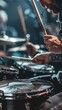 Dynamic close-up image showcasing the drummer's hands and sticks in full motion, embodying the driving force behind a captivating rock band performance.