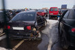 Broken and burnt cars after road accidents stand in a special parking lot