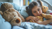 A Young Girl Is Laying In Bed With Two Stuffed Bears, Sick Girl