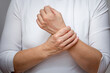 © Tatiana Foxy - Woman hands showing wrist pain over cropped body