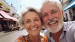 © DigitalDreamscape - Couple of gray haired mature smiling people travel and taking selfie portrait on phone. Wonderful cheerful man and woman. Active retirees are enjoying life. A man with a gray beard and a woman, travel