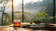 A peaceful morning with a steaming cup of tea overlooking a serene nature view at sunrise, offering a perfect moment of solitude and relaxation.