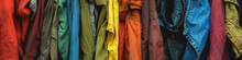 A Colorful Selection Of Jackets Arranged Side By Side, Showcasing A Variety Of Hues