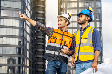 Wall Mural - Contractor, Two civil engineers checking information from blueprint with teamwork, project manager planning and collaboration, outdoor construction worker and floor plan for urban development in city