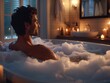 Man taking relaxing bubble bath with candles and essential oils in dimly lit bathroom