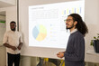 © ADDICTIVE STOCK - Business colleagues analyzing market data in meeting
