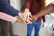 © ADDICTIVE STOCK - Diverse hands together in a gesture of teamwork