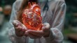 Female doctor touchstone virtual Heart in hand.Healthcare hospital service concept stock photo