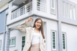 © KMPZZZ - New home owner, happy family asian young woman smile holding, cheerful girl showing apartment house key. Banker agreement mortgage loan purchase buy, property lease real estate for relocation