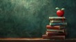 Back to school . The concept of the start of school Preparing to receive education for the new semester. background with books and apple on wooden table over blackboard 
