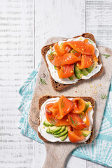 Wall Mural - Two open sandwich, toast with salmon, cream cheese, avocado