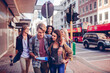 © Marko Geber - Young tourist people exploring the city with a map
