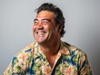 © hakule - A man wearing a Hawaiian shirt is smiling and laughing