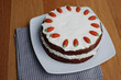 Homemade carrot cake with mascarpone cream cheese icing and mini marzipan carrot decorations