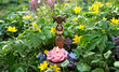 amulet of Triple Goddess Candlestick with flower candle on spring meadow, natural floral background. Symbol of the Triune Moon. esoteric ritual for Beltane. witchcraft, wiccan spiritual practice
