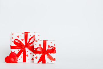 Wall Mural - gift box with red bow and red heart on colored background. Perspective view. Flat lay