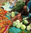 Vertical shot of selling potatoes and other vegetables at weekly market in Ankadeli, Orissa, India