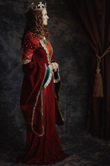 Wall Mural - Full length portrait of medieval queen in red dress with crown