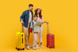 © Prostock-studio - Family ready for vacation with suitcases and map