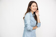 © comzeal - Young beautiful Asian woman in jeans shirt standing and smiling isolated on white background, Looking at camera