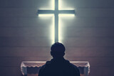Fototapeta Panele - Christian man praying in front of the cross
