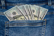 One hundred dollar banknote money in pocket jeans pants background texture. 100 dollar bill close up 3