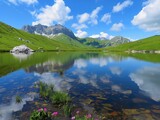 Fototapeta  - Reflections of a perfect sky in the still waters of an alpine lake