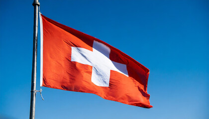 Wall Mural - Fahne, die Nationalfahne von der Schweiz flattert im Wind