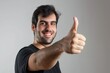 © Anna - man showing thumb up at camera isolated on white background