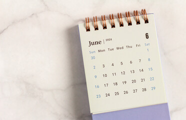 Wall Mural - Desktop calendar for June 2024 on a light background.