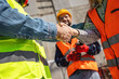 Contractor. construction worker team hands shaking after plan project contract  at construction site, contractor, engineering, partnership, construction concept