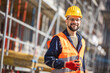 © Mediteraneo - Construction site manager standing  wearing safety vest and helmet, thinking at construction site. Young architect watching construction site with confidence.