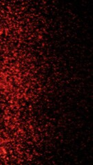 Wall Mural - Vertical Red Particle Rain Background 4K Loop features red glowing particles falling against a black background in a vertical ratio.