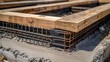 For the purpose of pouring concrete and laying a strong foundation for a building or home, metal reinforcement is attached to wooden formwork. Construction process. 