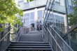 © Naypong Studio - Confident businessman descending outdoor stairs