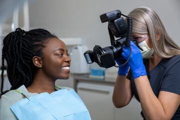 Dentist making photo of patient mouth after oral care