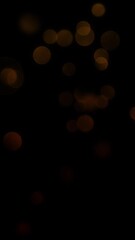 Wall Mural - vertical subtle lights motion on black 4k loop features spheres of red orange lights moving around i