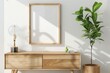 Mockup frame in living room interior, blank frame with sideboard against white wall, plants