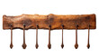 A wooden rack displays five hanging wooden spoons in a symphony of rustic kitchen decor