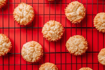 Wall Mural - Handmade coconut cookies on crimson grid