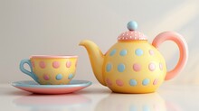 A Yellow Teapot With A Blue And Pink Polka Dot Design Sits On A Pink And Blue Saucer