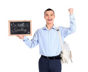 Wall Mural - Cheerful male student holding chalkboard with text SCHOOL GOODBYE on white background. End of school concept