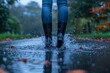 Puddle-proof footwear: a joyful individual splashes happily in rubber boots.