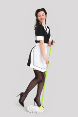 Poster - Beautiful pin-up chambermaid with mop on grey background