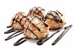 Coconut macaroons with chocolate drizzle on white background focused