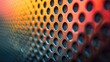 Close-up of a metallic honeycomb grid with a colorful gradient. Technology and modern design concept for textures, wallpapers, and tech-themed backgrounds.