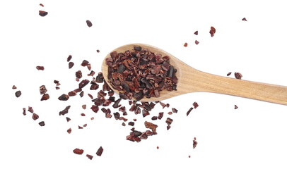 Wall Mural - Cacao nibs, crushed and peeled cocoa in wooden spoon, isolated on white, top view