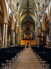 Wall Mural - Lincoln Cathedral, Roman Catholic Gothic church and cathedral with stain glass window corridor and hall, with arches, columns, pews, vault, aisles, gallery, arcades and clerestory.